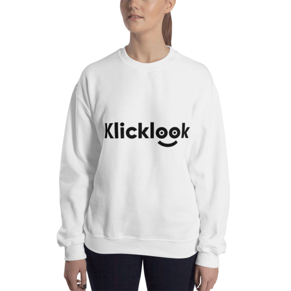 A young woman is wearing stylish Klicklook Unisex Crew Neck White Sweatshirt.